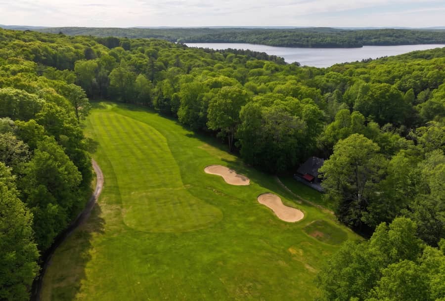 Hole 6 dogleg left at Paupack Hills with Lake Wallenpaupack in the distance